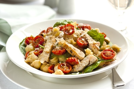 Creamy chicken and spinach pasta, with roasted cherry tomatoes and shaved parmesan   Delicious healthy eating の写真素材