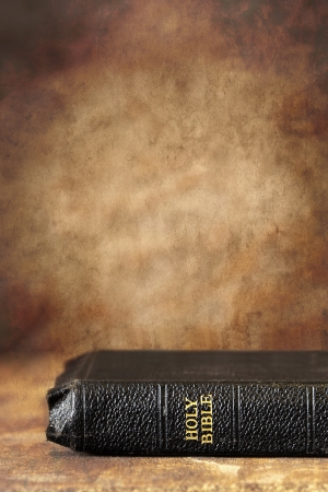 Old Holy Bible, over a grunge stone background   Lots of copyspace の写真素材