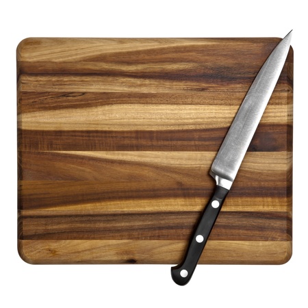Stainless Steel kitchen utility knife on a wooden chopping board.  Isolated on white.  Overhead...