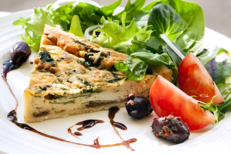 Spinach quiche with a healthy salad and balsamic glaze の写真素材