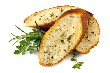 Garlic bread with herbs, isolated on white の写真素材