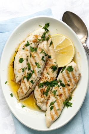 Chicken with garlic and lemon.  Overhead view.の写真素材