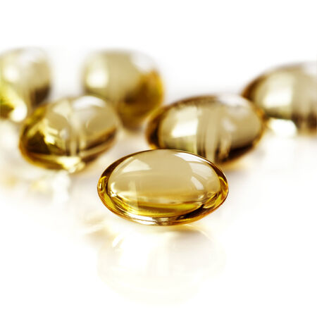 Gel capsules isolated on white.  Vitamin D.の写真素材
