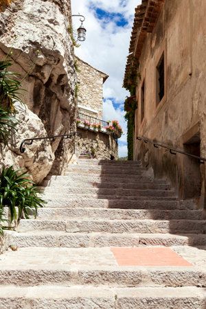 Winding narrow stone streets in Eze near Nice, France.