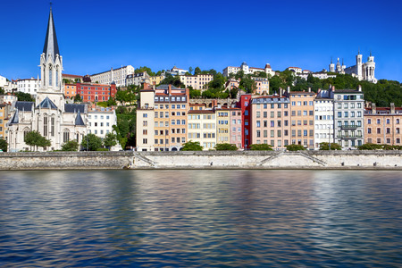 Houses on banks of Saone River, Lyon, France.  Fourviere Basilica on hill.の写真素材