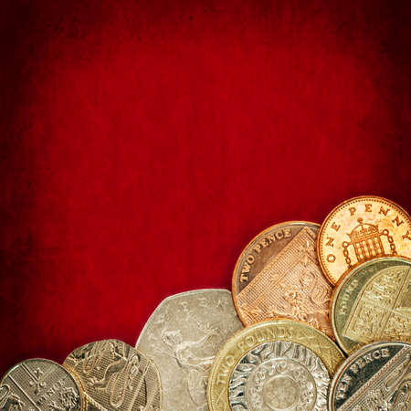 British coins over red grunge background.の写真素材