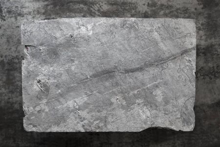 Slate background.  Gray slate over dark marble. Overhead view.の写真素材