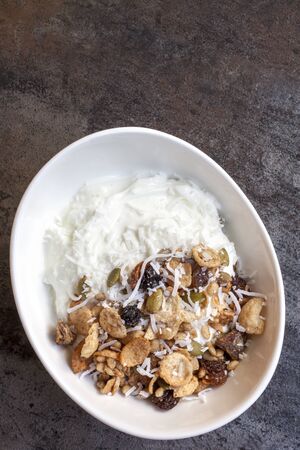 Yoghurt muesli or yogurt grenola with coconut.の写真素材