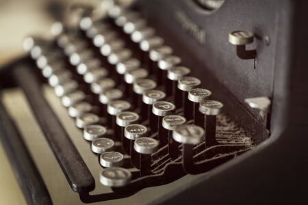 Vintage typewriter keys covered in dust.  Selective focus.