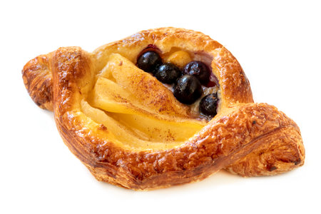 Delicious Danish pastry with apple and blueberries, isolated on white background.の写真素材