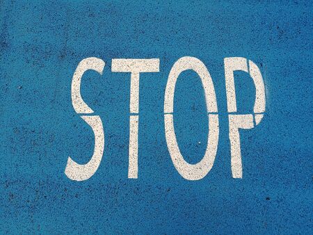 stop sign on asphaltの写真素材