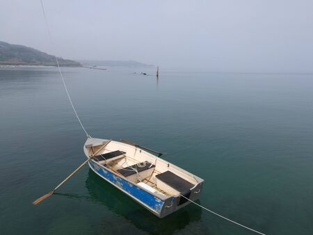 boat in foggy seaの写真素材