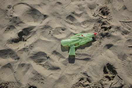 abandoned toys on the beachの写真素材