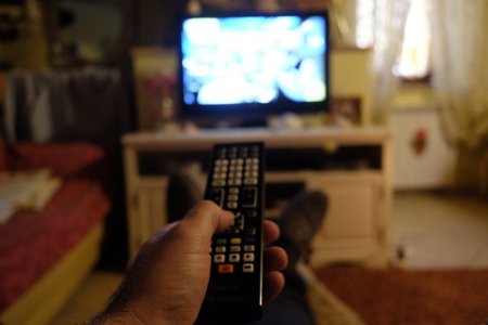 change channel with the remote controlの写真素材