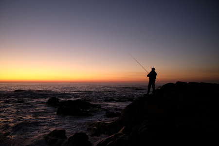 fisherman at sunset