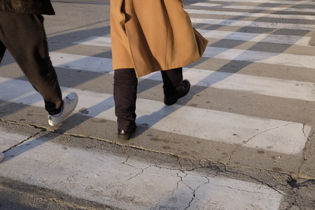 people cross over crosswalksの写真素材