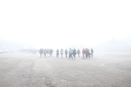 unrecognizable people in the fogの写真素材