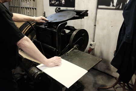 operator at work on old typographic machine
