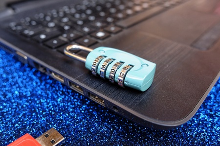 padlock with combination on laptop