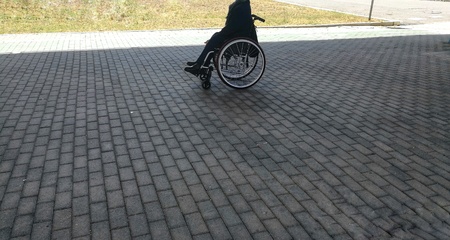man in wheelchair unrecognizableの写真素材