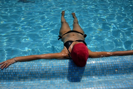 girl enjoys the poolの写真素材