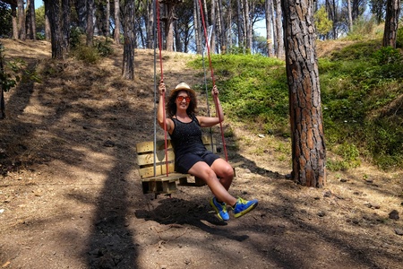 girl on swing made of pallets
