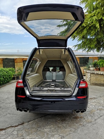 open and empty hearse by day