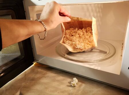 cooking popcorn in the microwaveの写真素材