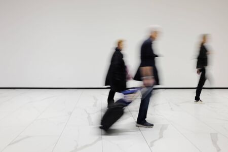 people out of focus at the airport