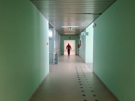 hospital corridor with unrecognizable peopleの写真素材