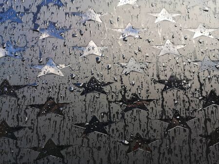 car window with stars in the rainの写真素材