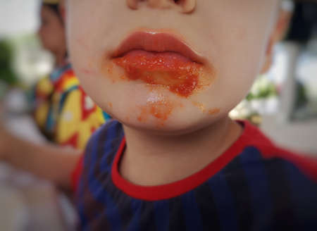face dirty with tomato sauce