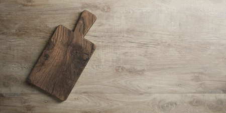 rustic wooden cutting board on table top as template - 3D illustrationの写真素材