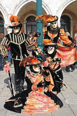 VENICE, ITALY - MARCH 4: Unidentified masked persons pose in front of Palazzo Ducale during the Venice Carnival on March 4, 2011 in Venice, Italy. The carnival is from February 26 - March 8, 2011. のeditorial素材
