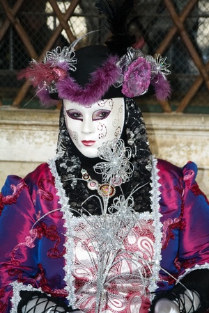 VENICE, ITALY - MARCH 3: An unidentified masked person stands in front of the Palazzo Ducale during the Venice Carnival on March 3, 2011 in Venice, Italy. The carnival is from February 26 - March 8, 2011.のeditorial素材
