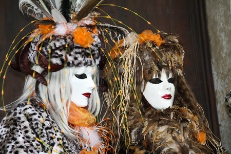 VENICE, ITALY - MARCH 3: Unidentified masked persons stand in front of Palazzo Ducale during the Venice Carnival on March 3, 2011 in Venice, Italy. The carnival is from February 26 - March 8, 2011.のeditorial素材
