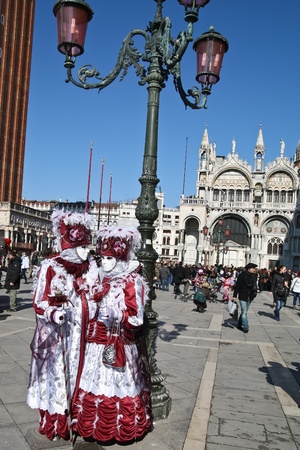 VENICE, ITALY - MARCH 4: Unidentified masked persons stand on San Marco square during the Venice Carnival on March 4, 2011 in Venice, Italy. The carnival is from February 26 - March 8, 2011.のeditorial素材