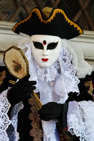 VENICE, ITALY - MARCH 4: An unidentified masked person stands in front of the Palazzo Ducale during the Venice Carnival on March 4, 2011 in Venice, Italy. The carnival is from February 26 - March 8, 2011.のeditorial素材