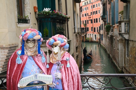 VENICE, ITALY - MARCH 3: Unidentified masked persons stand on the street during the Venice Carnival on March 3, 2011 in Venice, Italy. The carnival is from February 26 - March 8, 2011.のeditorial素材