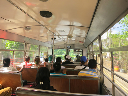 GRAND BAY, MAURITIUS - NOVEMBER 2: Group of people sitting in public bus, November 2, 2013 in Grand Bay, Mauritius.のeditorial素材