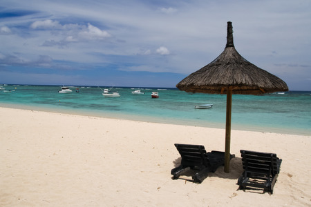 Umbrella with two chairs on the beach, Mauritiusの写真素材