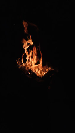 fire and flames burning in black dark background for wallpaper and ornaments poster
