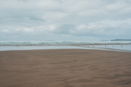 View of the sandy beach in cloudy dayの写真素材