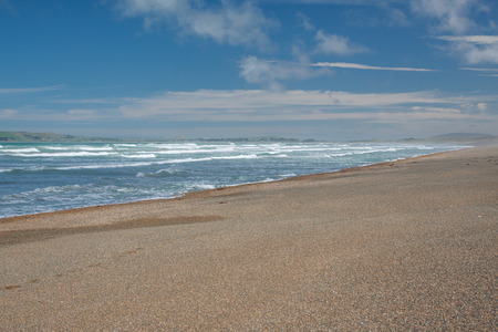 Time on sky and sand of beachの写真素材