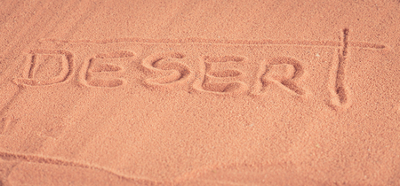 "Desert" inscription on the sandの写真素材