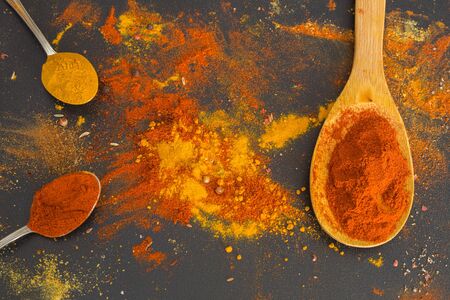 Various spices spoons on stone tableの写真素材