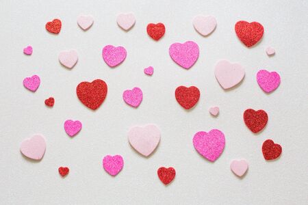 Hearts on glossy background on Valentines day