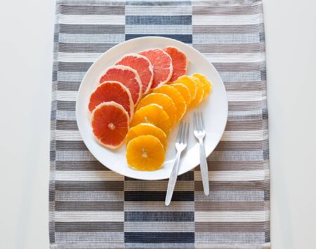 Cutting fresh fruits / vitamins conceptの写真素材