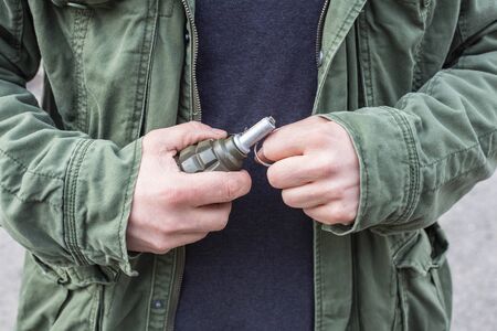 Man with a grenade in his handsの写真素材