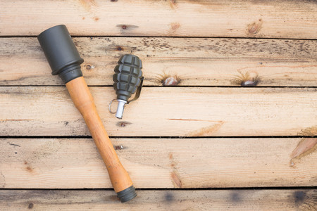 Grenades on wooden board with place for a textの写真素材
